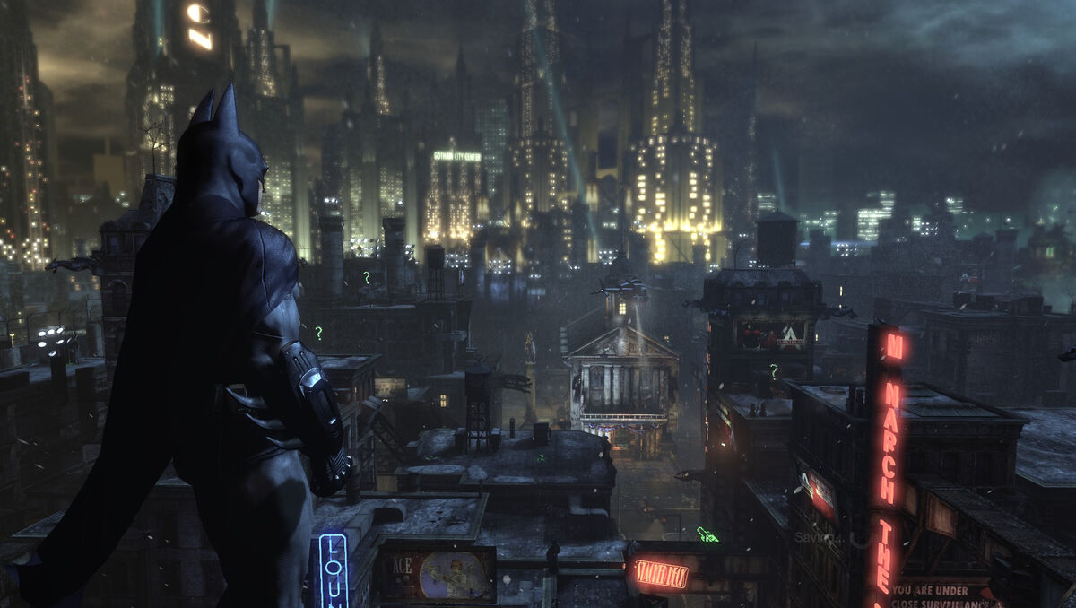 Batman overlooking his new surroundings in Arkham City.
