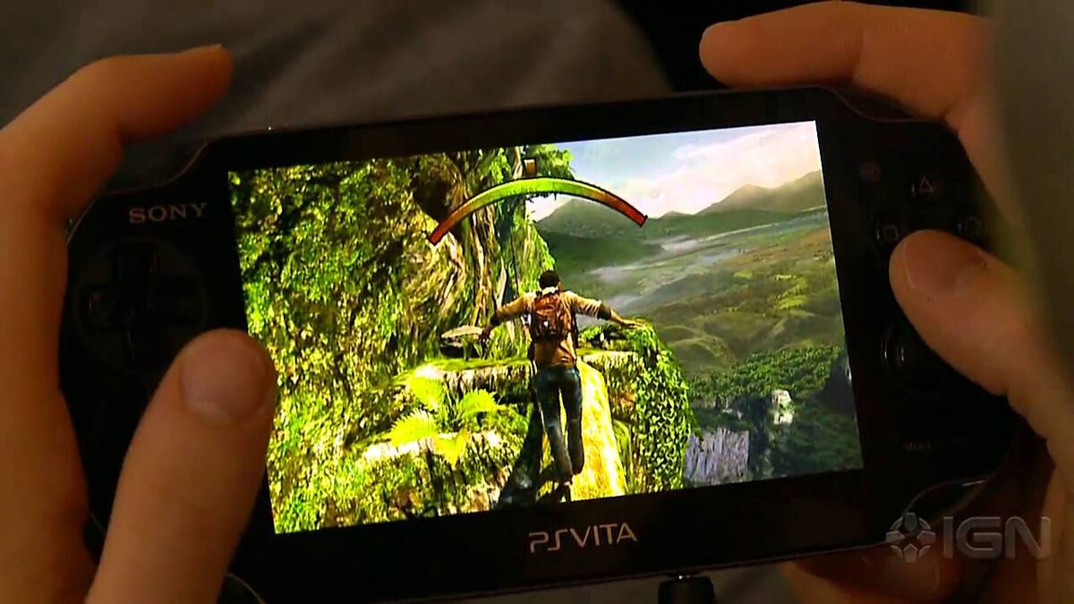 Hands playing Uncharted Golden Abyss on the PSVita