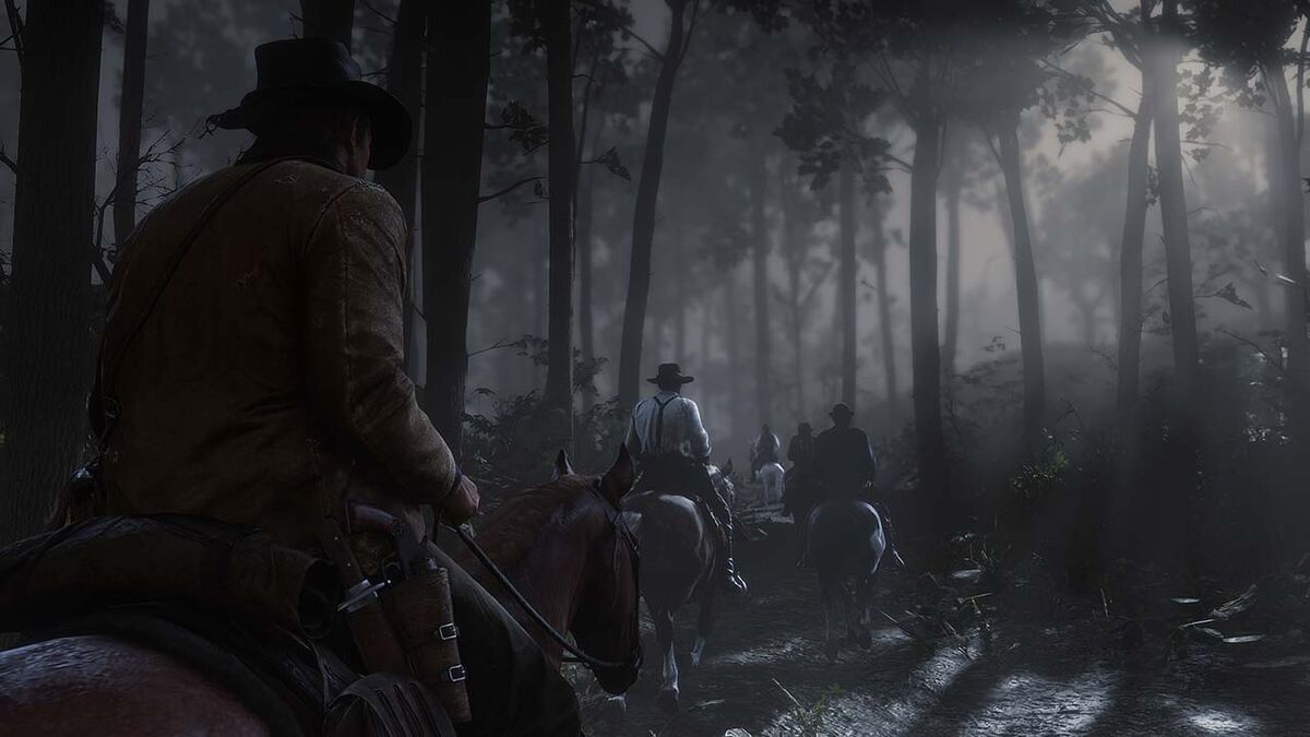 Riding a horse with gangmates through forest in nightime in Red Dead Redemption 2.