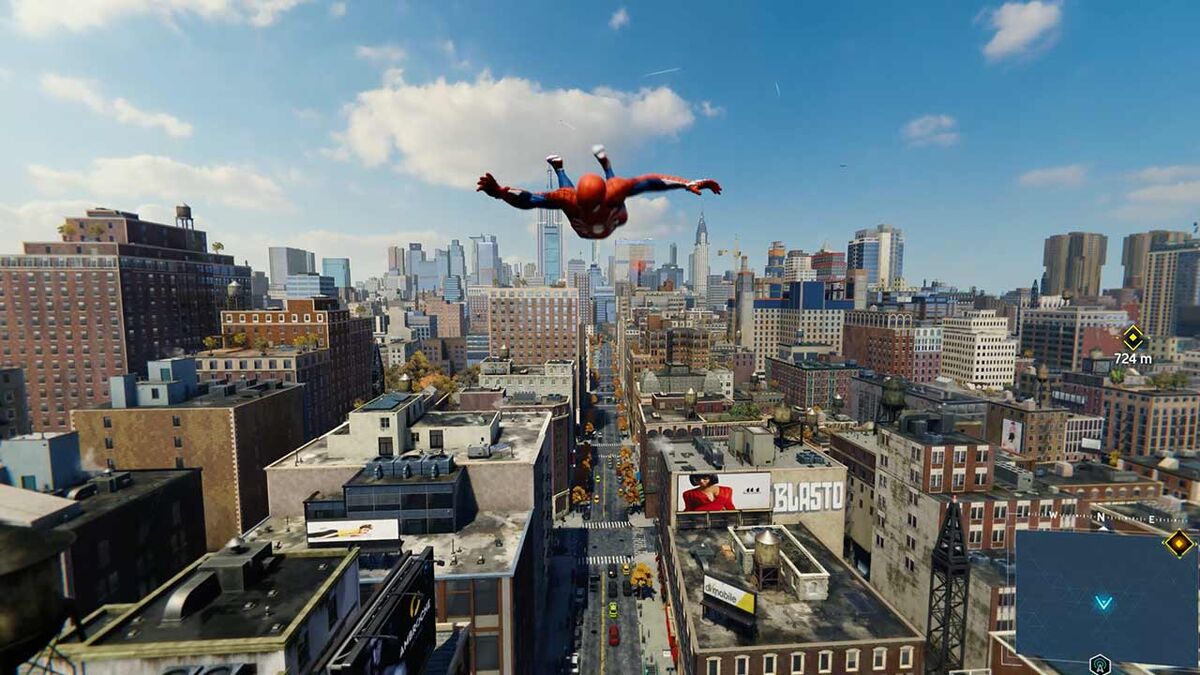 Spider-Man soars through the air between buildings