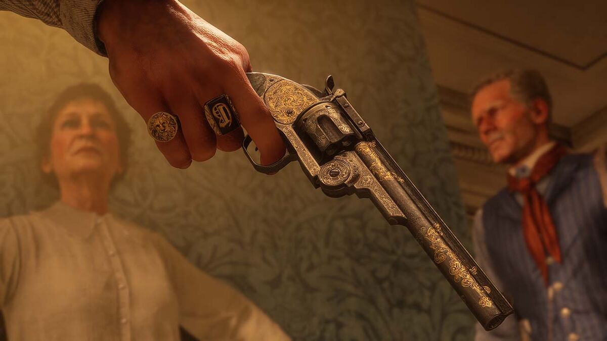A metal pistol with golden engravings in Red Dead Redemption 2.