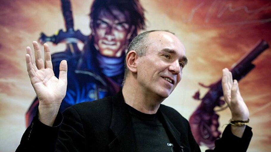 peter molyneux in front of Fable promo image