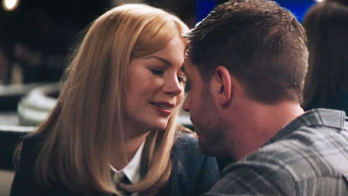 Michelle Williams and Tom Harday gazing into each other&#039;s eyes in Venom