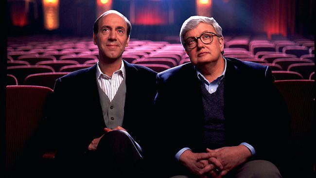 Siskel and Ebert sitting in an empty movie theater. 