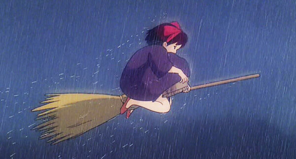 Kiki flying in the rain.