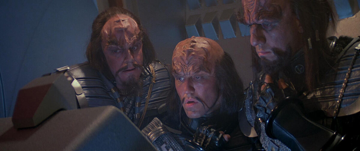 Klingons look at a monitor baffled