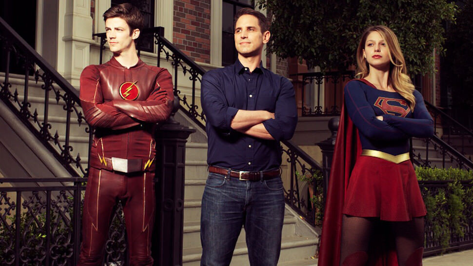 Grant Gustin as The Flash, Greg Berlanti and Melissa Benoist as Supergirl