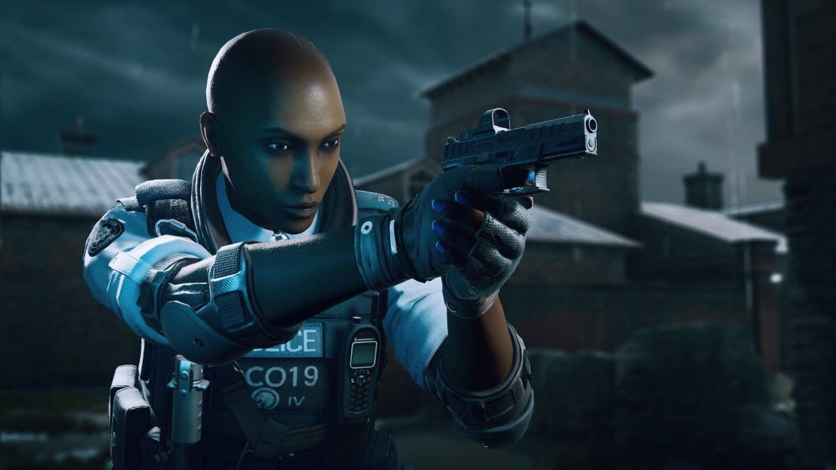 Clash holds a pistol and looks to the side.