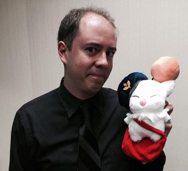 Koji Fox holds a Final Fantasy plush toy