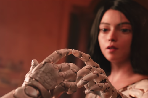 Alita looking at herself in mirror