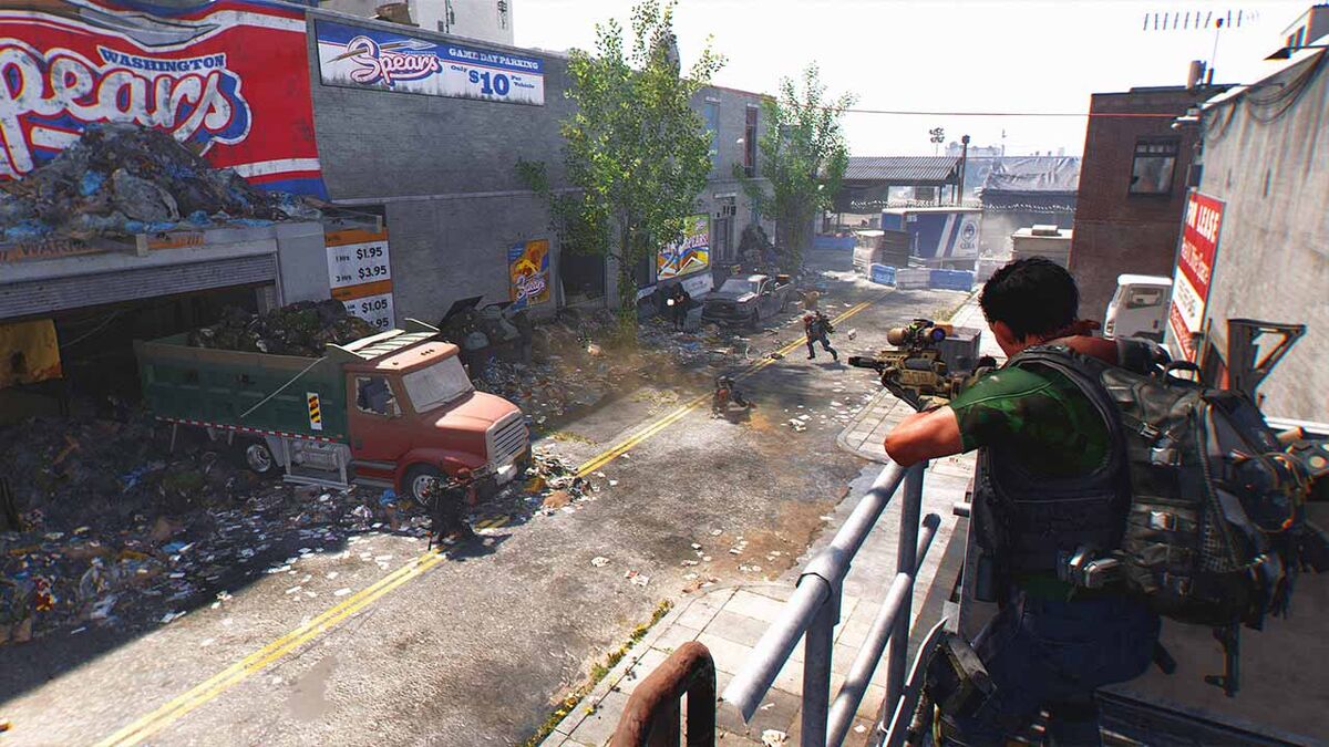 A player holds overwatch position on a street with a sniper rifle