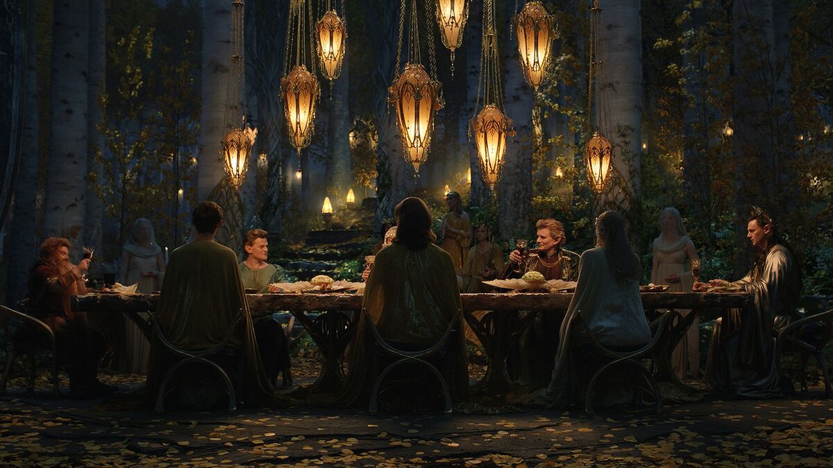 Dwarf prince, Durin, dines with elves including Elrond, Celebrimbor, and Gil-galad in a scene from The Lord of the Rings: The Rings of Power.