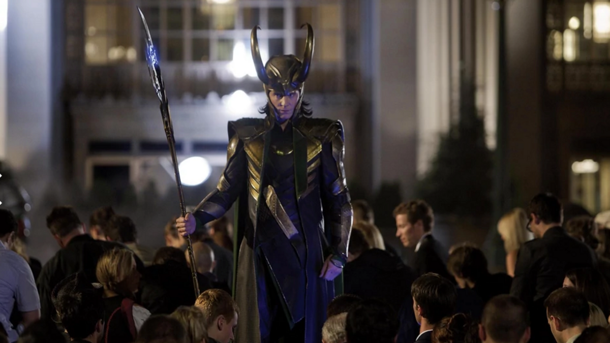 Loki forces a crowd in  to kneel