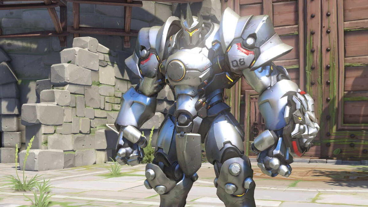 Reinhardt stands facing the camera.