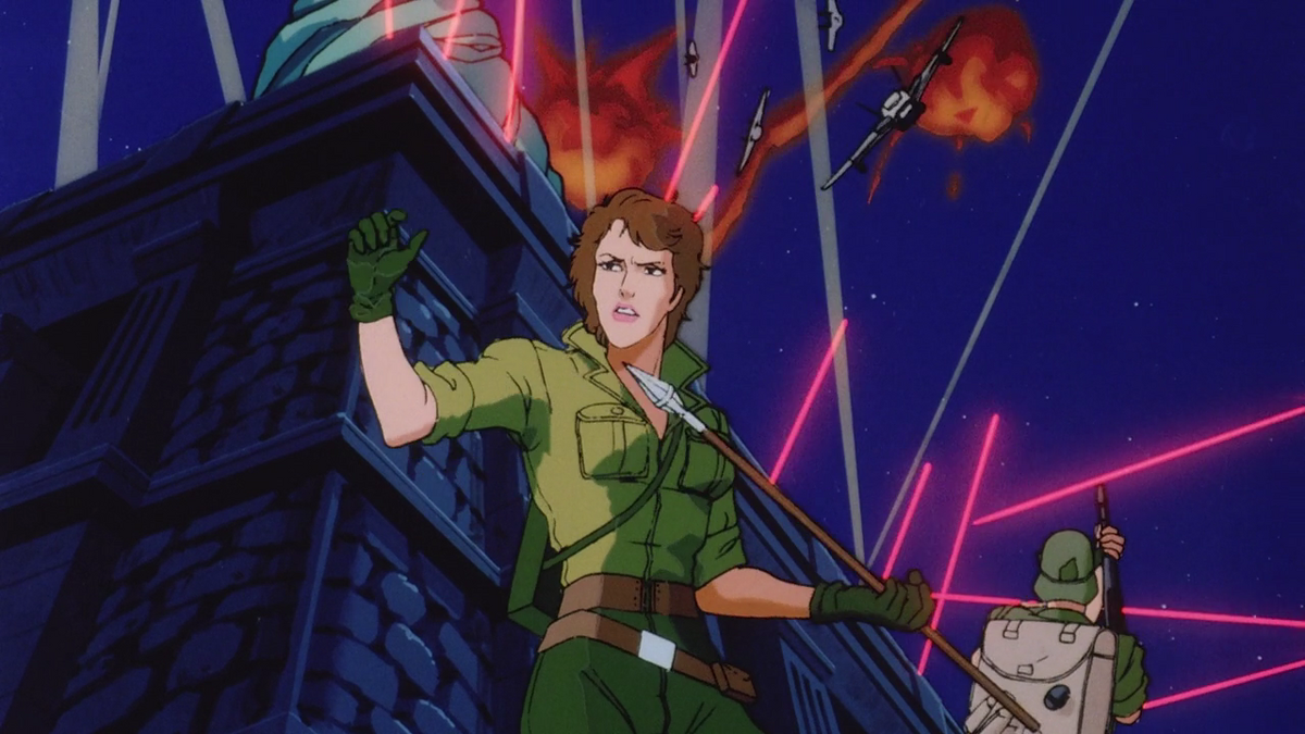 Lady Jaye leading an assault on a Cobra Fortress. Above her an aerial battle lights up the night sky.