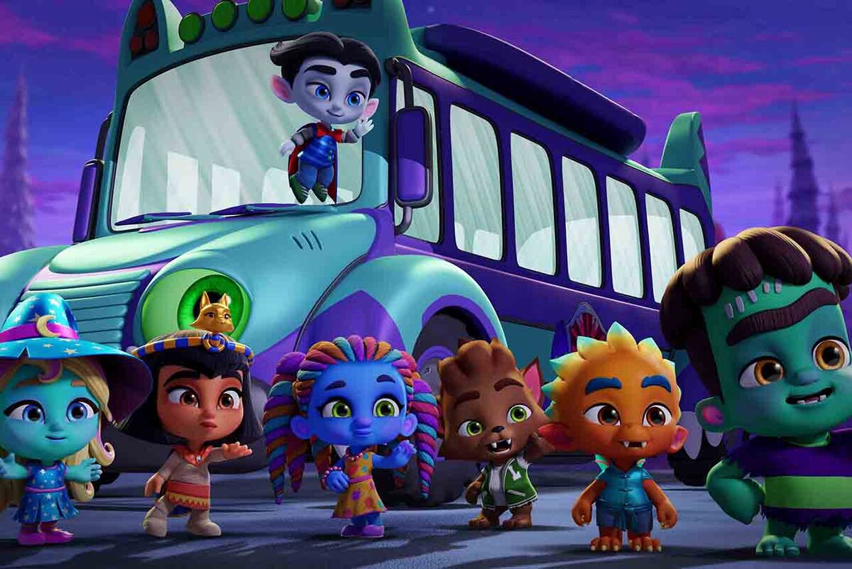 The gang of Monster Party outside a bus.