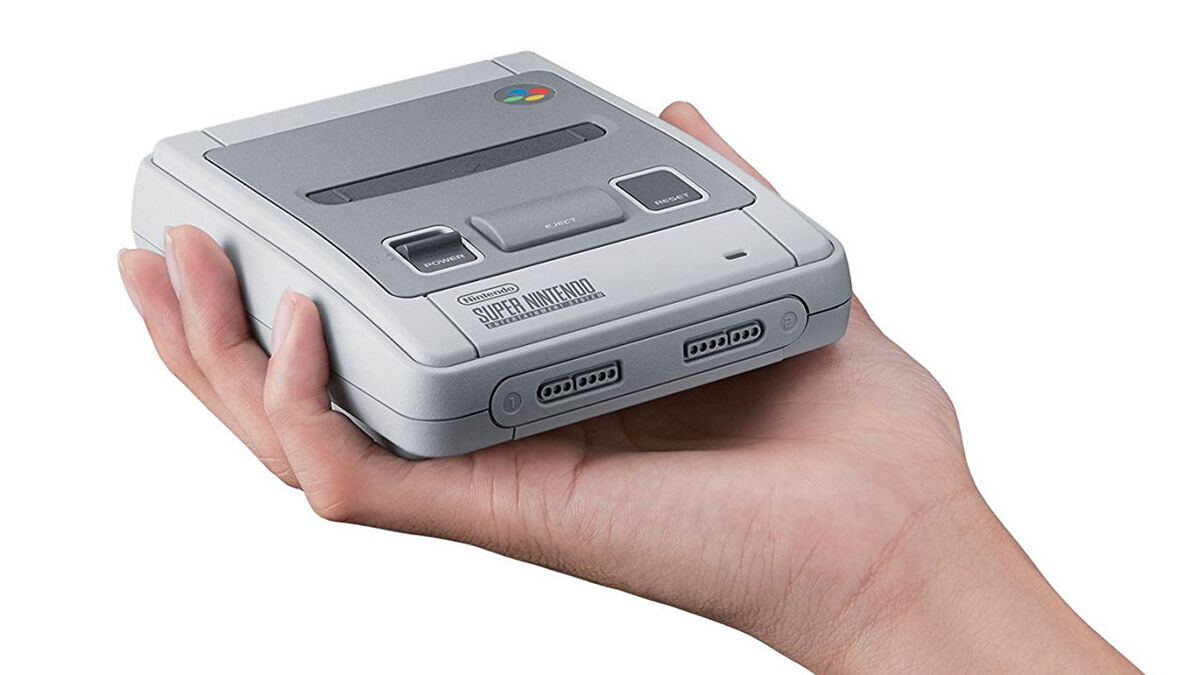 SNES Classic Mini held in one hand