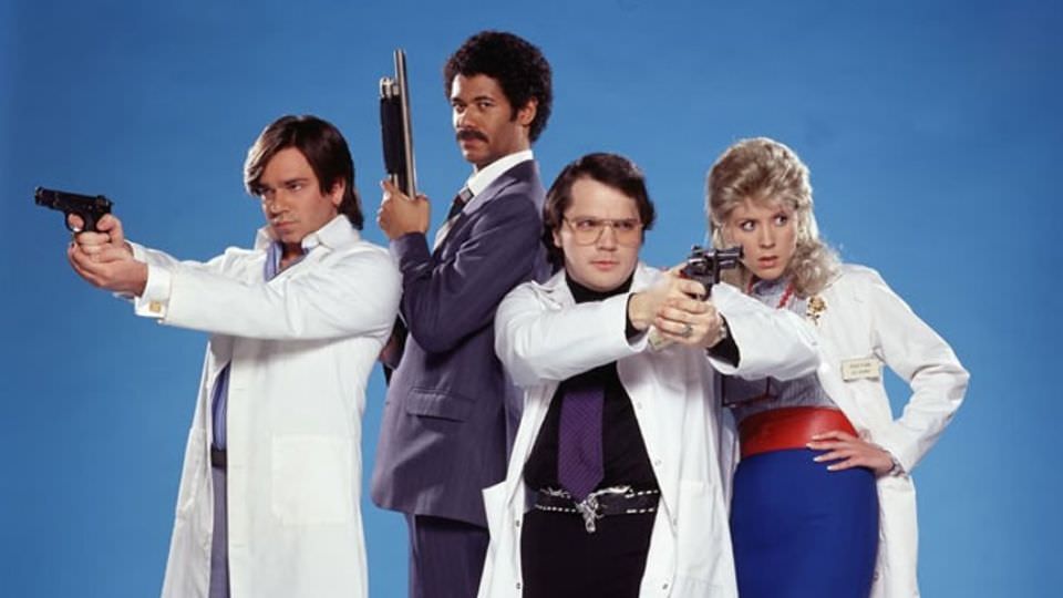 garth marenghis darkplace cast in lab coats and weilding weapons