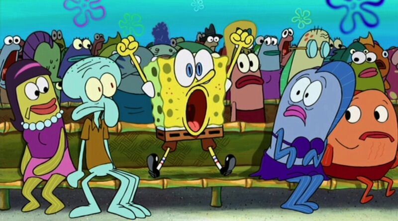 SpongeBob sits on a bench surrounded by fish. He jumps up feet and hands out, with a surprised look.