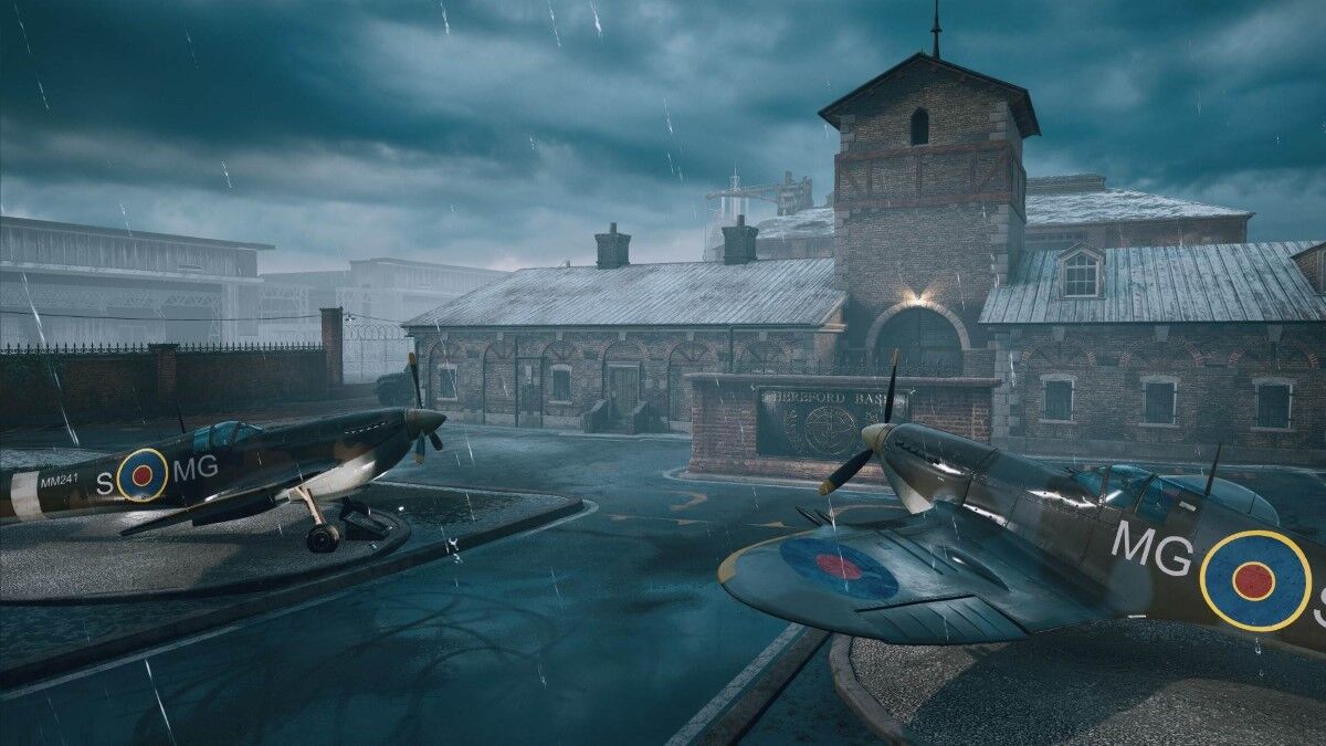 Two planes are parked outside a building.