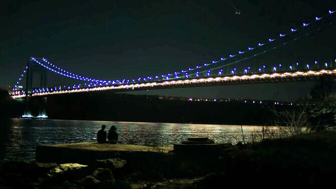 The Night Of Manhattan Bridge and two silhouettes 