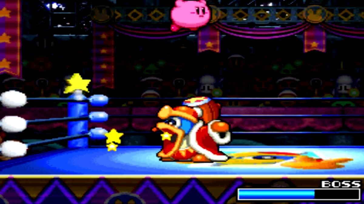 Kirby fighting King Dedede in Kirby Super Star Ultra