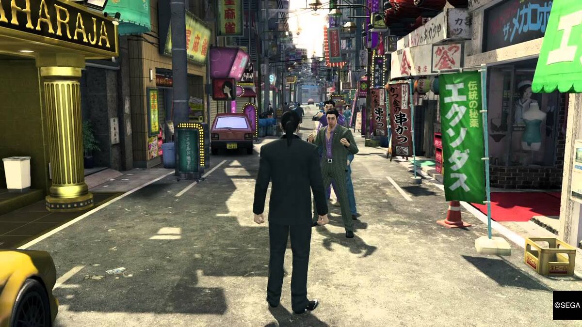 Gangsters challenge the player to fight on the street in Yakuza Zero.