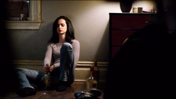 Jessica Jones and three bottles of alcohol. 