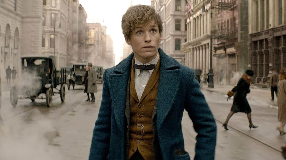 Newt walks on a city street