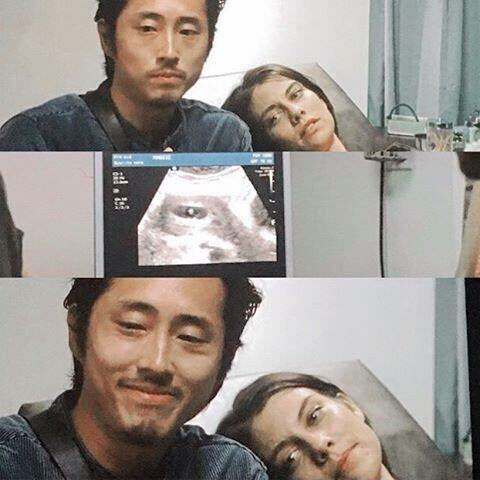 Glenn and Maggie looking at a sonogram of their baby