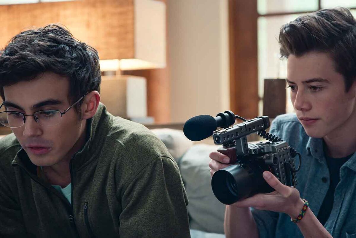 Two young people sit together holding a camera in American Vandal.