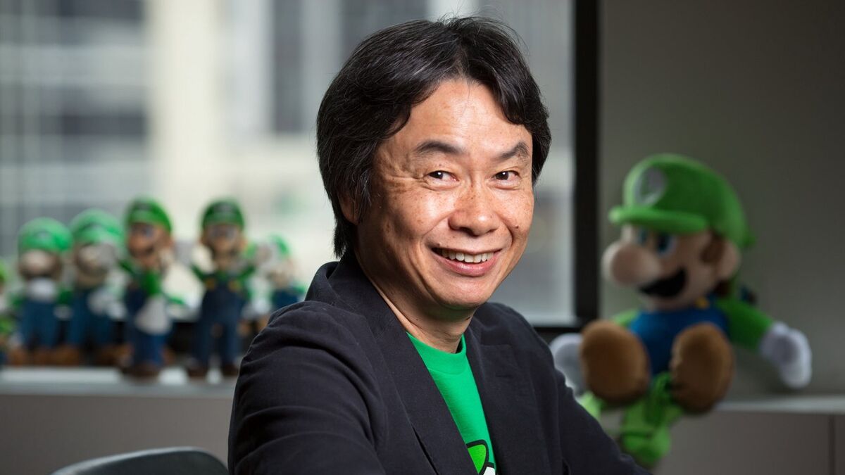 Shigeru Miyamoto, surrounded by an unsettling amount of Luigis