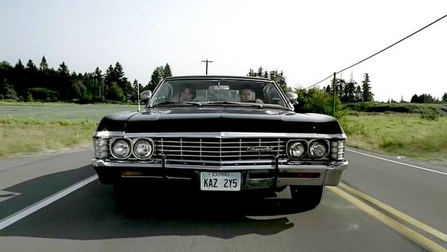 Supernatural black Chevrolet 67 Impala driving on the road