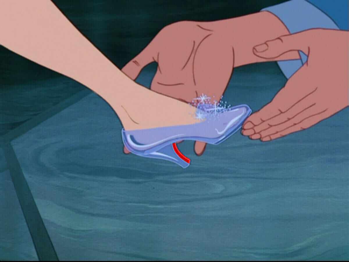 prince puts shoes on cinderella