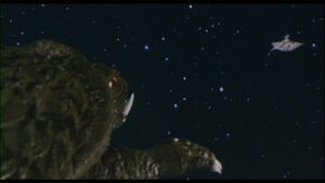 Gamera charges towards his final destiny with the Zanon ship.
