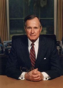George HW Bush at desk