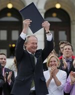 Chafee-after-signing-ssm-bill