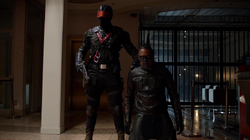 Mr. Terrific held hostage by Vigilante