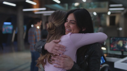 Kara and Maggie hug