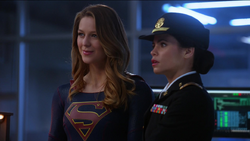 Lucy learns that Colonel Harper left command the of D.E.O. to her
