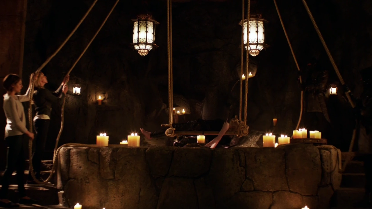 Image - Sara Lance's corpse being lowered in to the ...