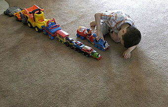 autism lining toys up