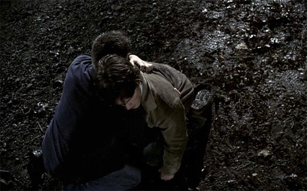 Dean holding his dying brother