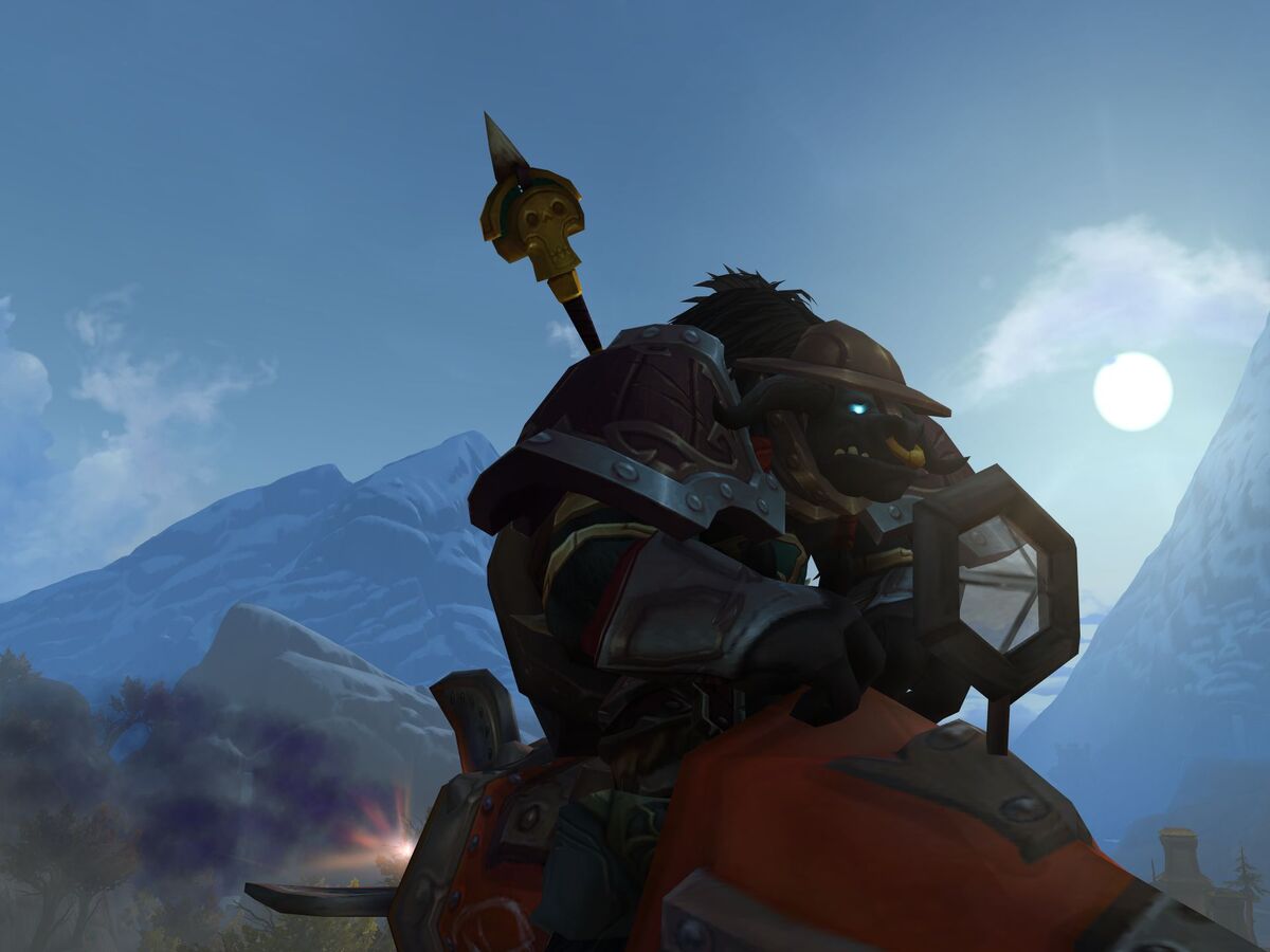 A Tauren rides a mount.