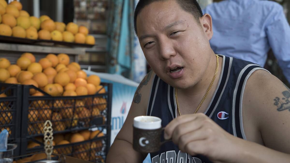 huangs-world-eddie-huang in street-side cafe with turkish coffee