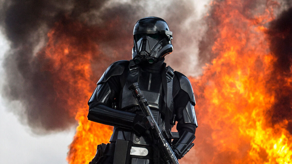 stormtrooper in black with fiery background star wars