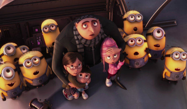 Despicable Me Gru with children and surrounded by gaping minions