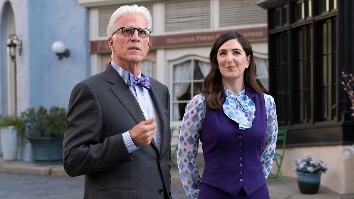 Janet stands beside the designer in The Good Place Season 5.