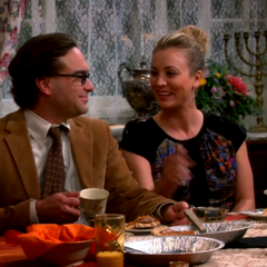 Penny strokes Leonard's chin