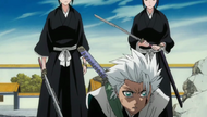 Reigai tower over a fallen Hitsugaya